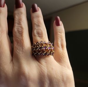 10k yellow gold w amethysts, garnets,and diamonds. Size 7